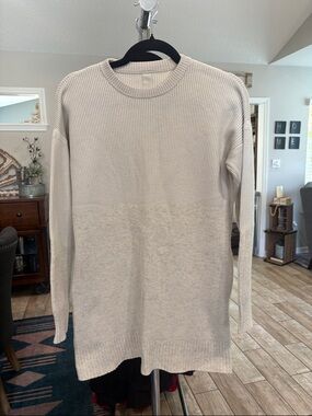 cream-colored Lululemon ribbed tunic sweater